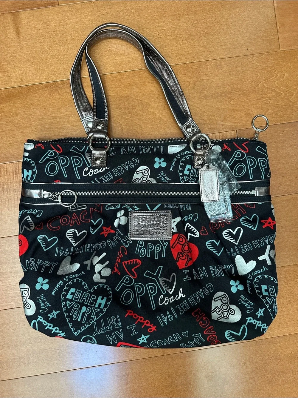 NWOT Coach Black Multi Poppy Heart Print Tote with Silver Trim